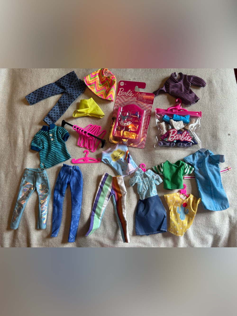 Lot of Barbie clothes and accessories